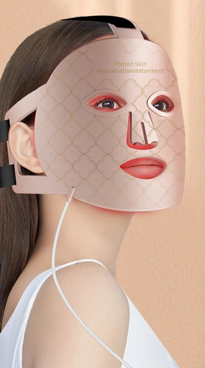 Woman wearing the LED light therapy face mask during an at-home session
