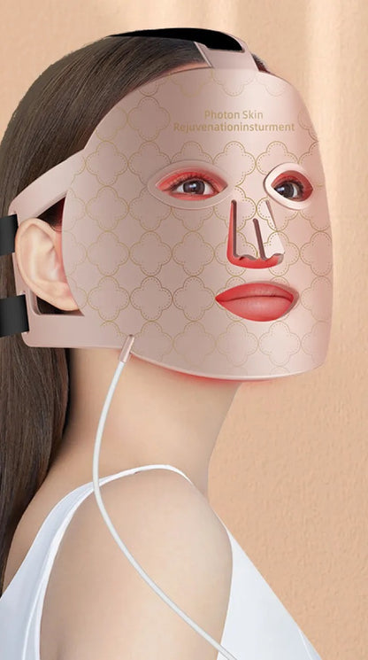 Woman wearing the LED light therapy face mask during an at-home session