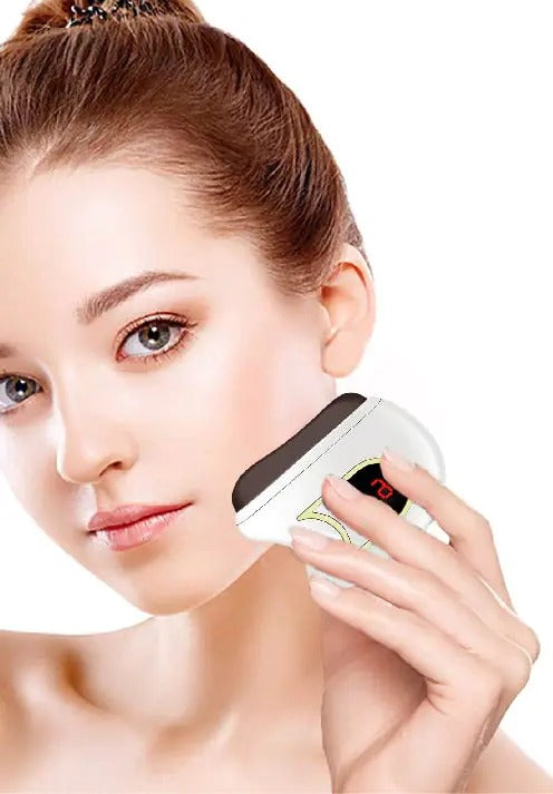 Woman using the electric gua sha along her jaw for a 5-minute morning depuff