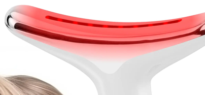 Close-up of the wand's curved T-shaped LED head glowing red, shaped to follow the neck and jaw contour.
