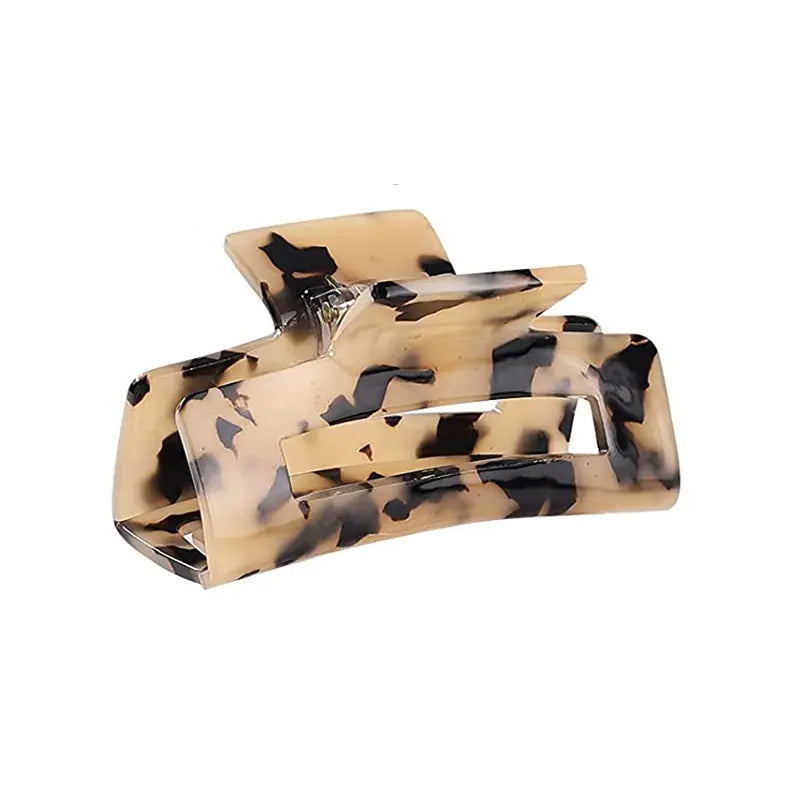 Large tortoise shell acetate claw clip on a white background