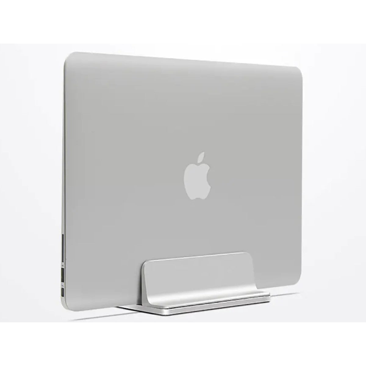 Silver aluminum vertical laptop stand holding a MacBook upright on a desk