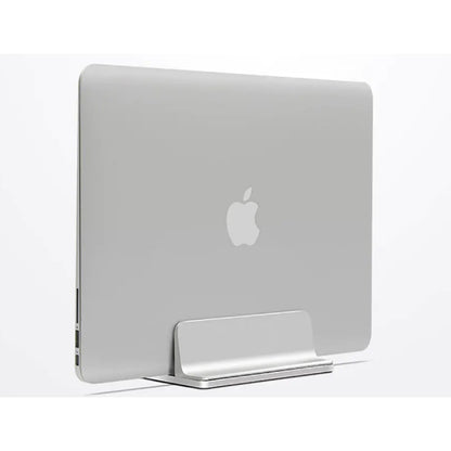 Silver aluminum vertical laptop stand holding a MacBook upright on a desk
