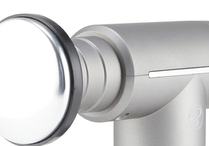 Close-up of the massage gun body showing the LCD control strip and the heated contact head