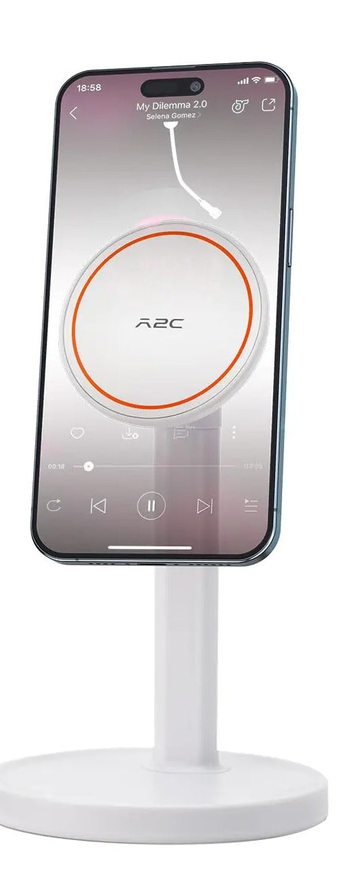 White MagSafe desk phone stand holding an iPhone in portrait on a round non-slip base